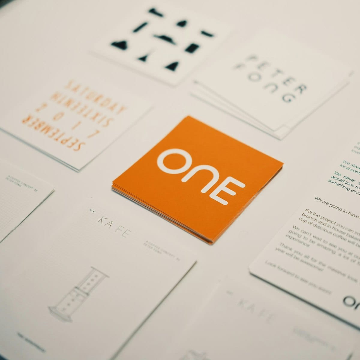 A brand identity laid out across printed stationery