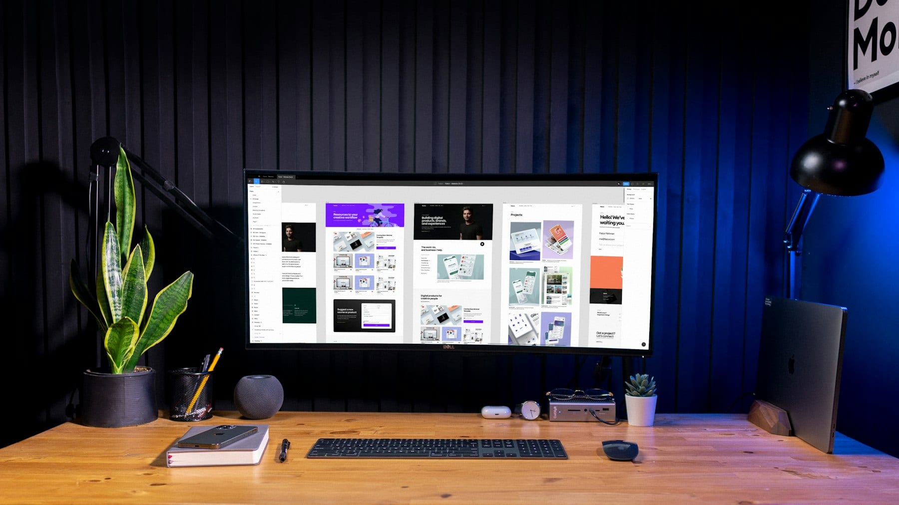 A design studio at work, brand layouts on screen